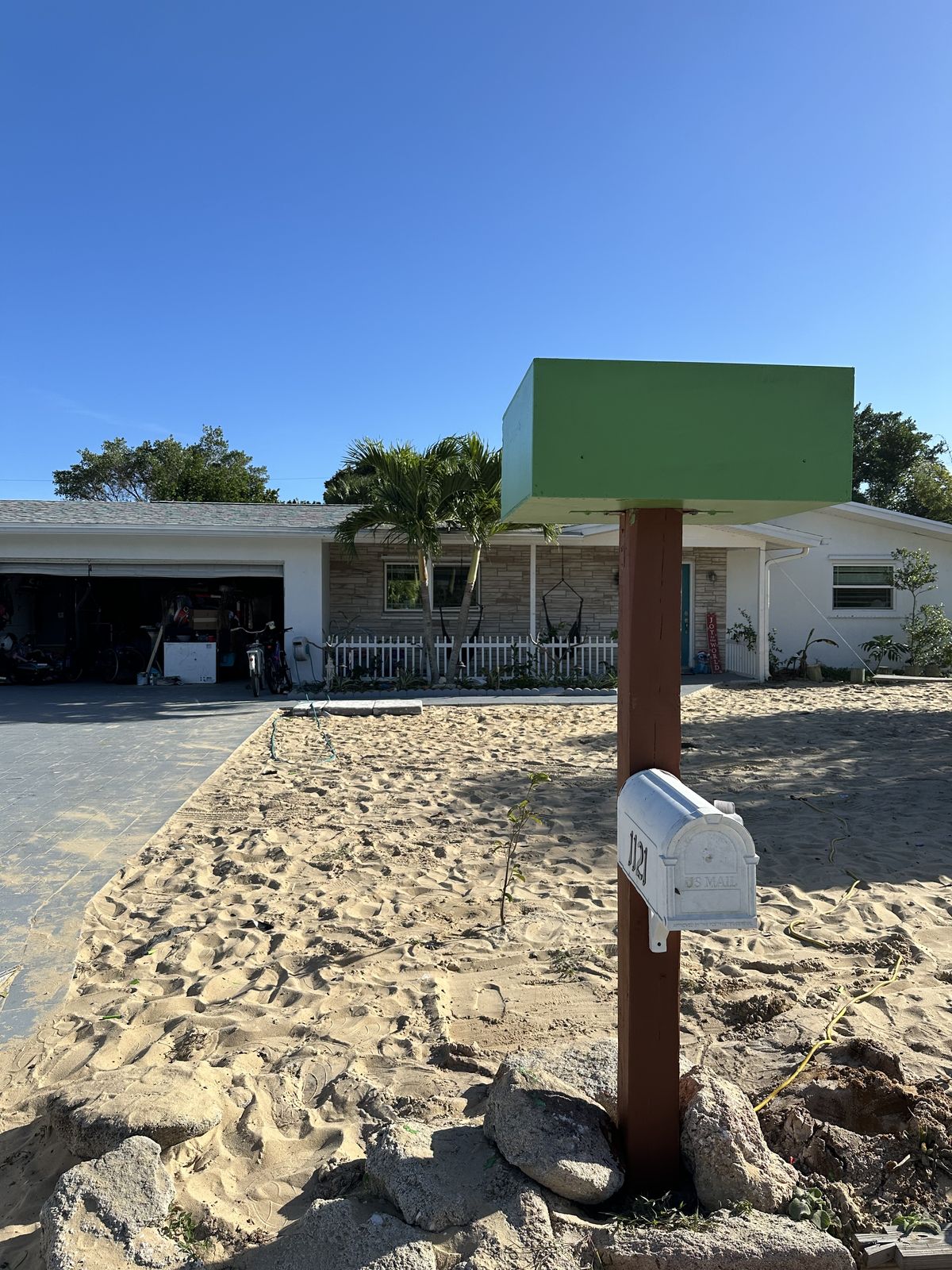 The Spacey Box mailbox by day on a beach path